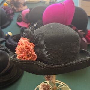 Elegant Black Hat with Peach Floral Accent